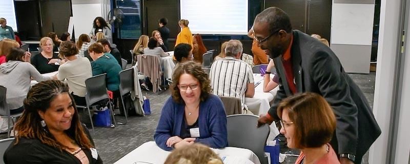 Dr. Taylor listening to teachers